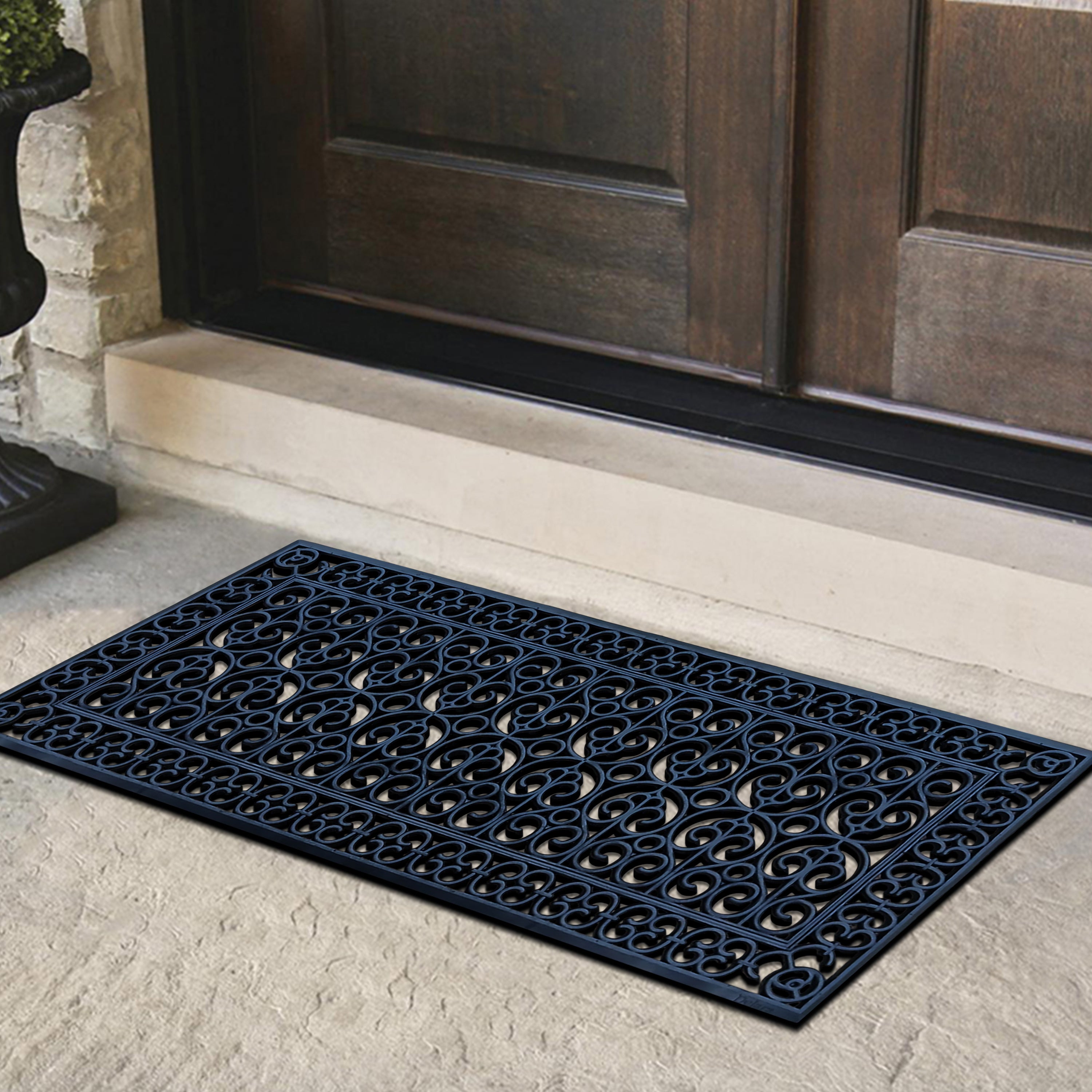 decorative scrollwork rubber doormat outside entrance