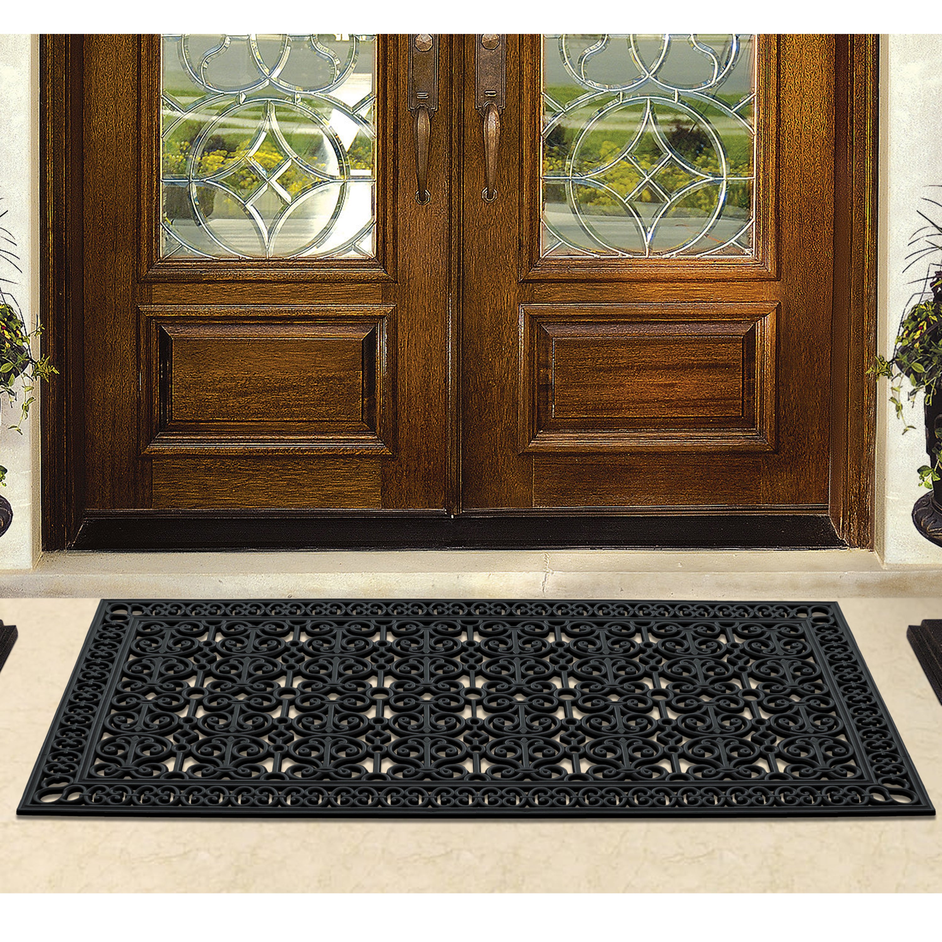 black scroll pattern rubber door mat outside entrance