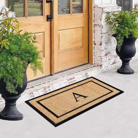 Monogrammed front door mat for porch entrance